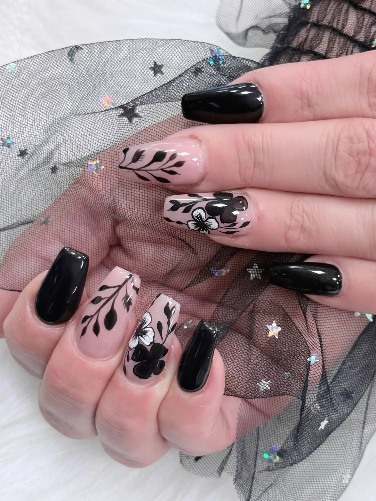 Blush and black floral nail art