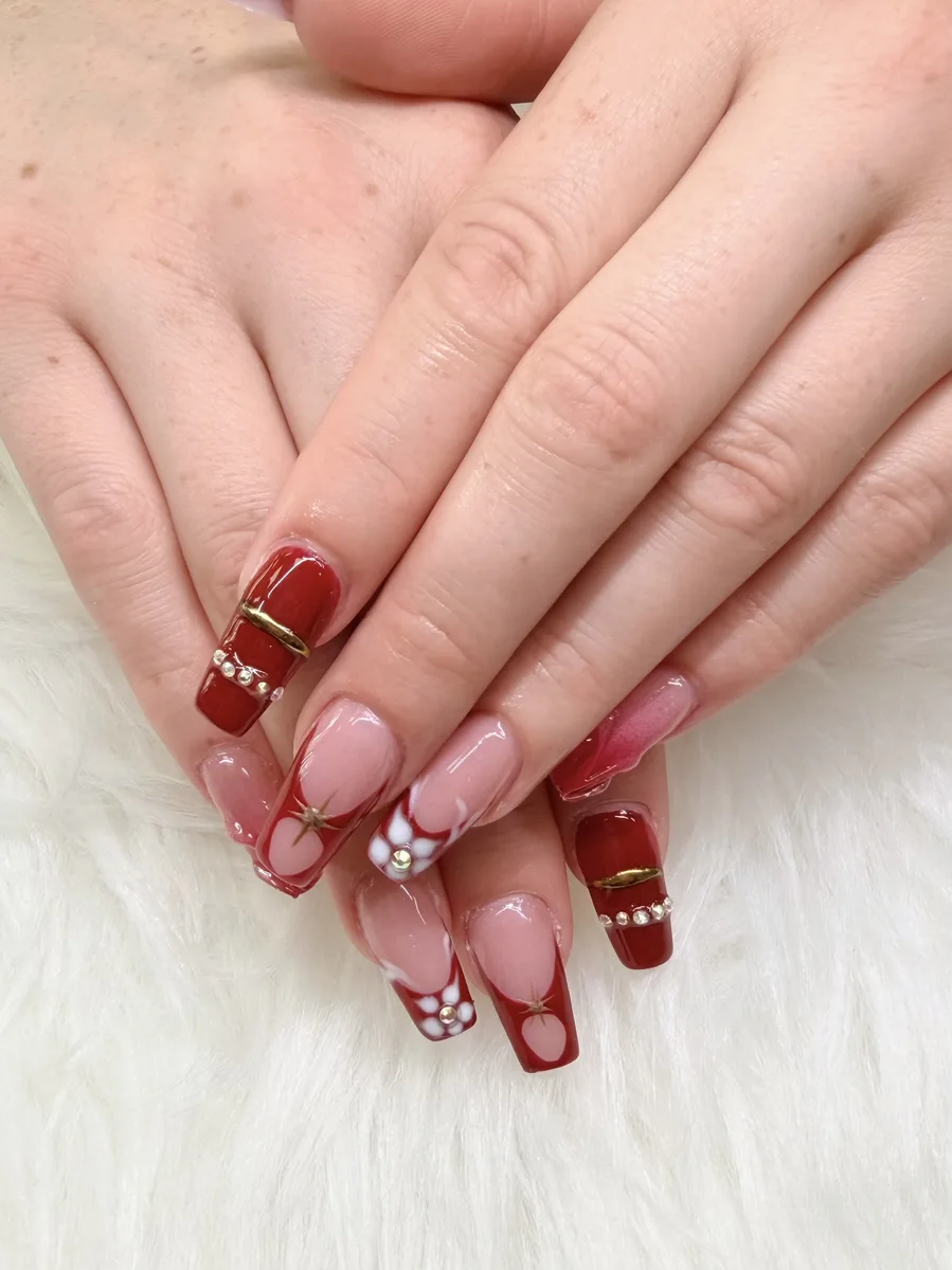 Red and pink nail art with heart details